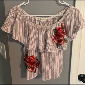 Off the shoulder pink and white floral shirt